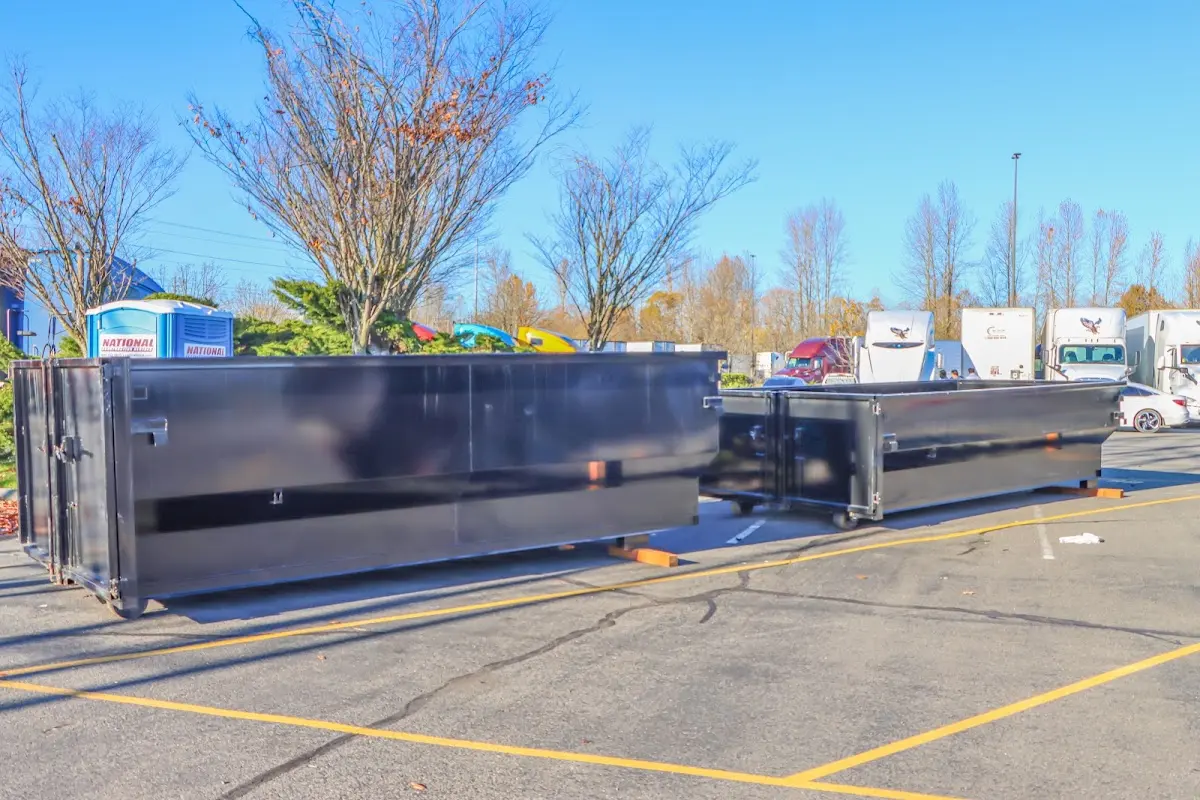 Professional dumpster rental service with roll-off container on residential driveway in Fair Oaks Ranch